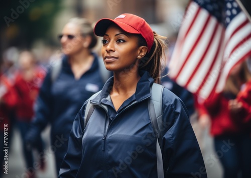 Confident woman in uniform at a patriotic parade with an American flag in the background