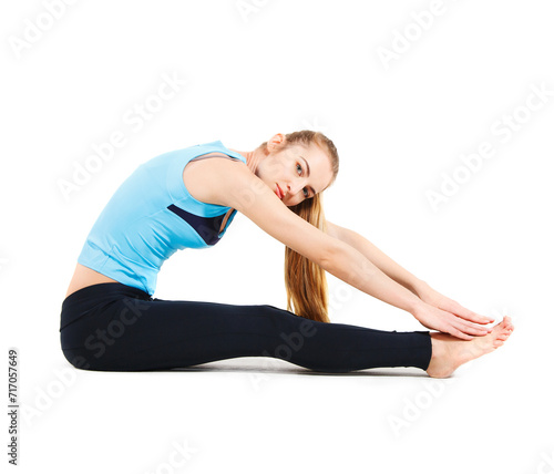 Blond young woman doing her yoga stretch