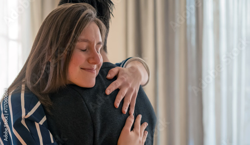 Fotografi A couple in romantic relationship, girl warm hugs a man.