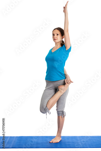 Yoga - young beautiful woman yoga instructor preparing for Half Bound Lotus Standing Forward Bend(Ardha Baddha Padmottanasana) asana exercise isolated on white background