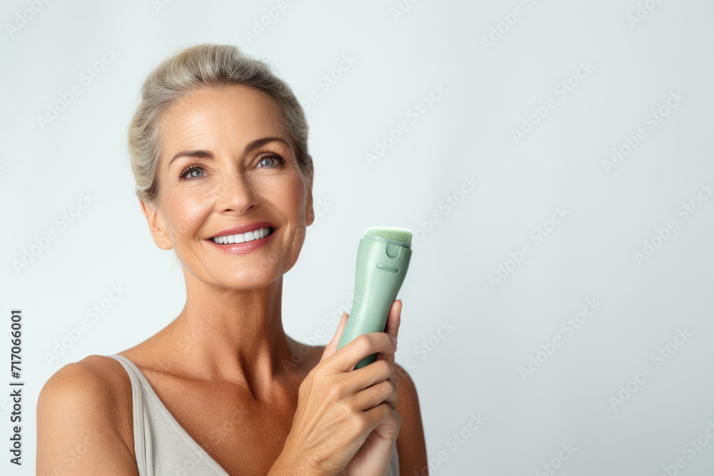 radiant mature woman smiles brightly while holding a green facial cleansing brush, showcasing the joy of skincare in the beauty industry radiant mature woman smiles brightly while holding a green facial cleansing brush, showcasing the joy of skincare in the beauty industry