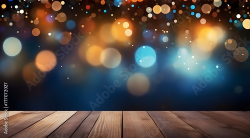 Wooden table with bokeh lights on dark blue background.