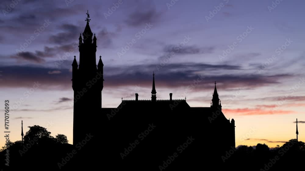 International Court of Justice of UN, Time Lapse at Twilight with Colourful Sky and Dark Silhouette of Peace Palace, The Hague, Netherlands International Court of Justice of UN, Time Lapse at Twilight with Colourful Sky and Dark Silhouette of Peace Palace, The Hague, Netherlands
