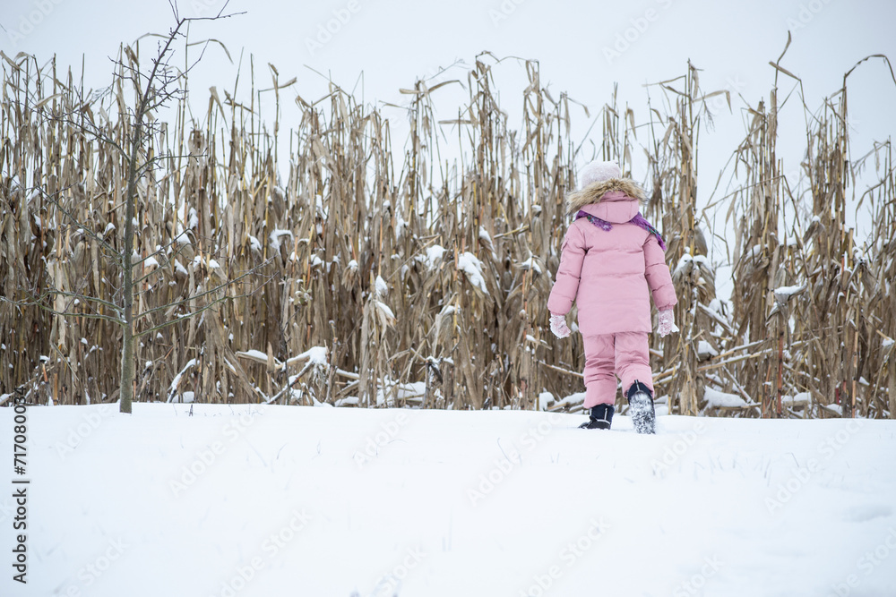 girl walking in the snow