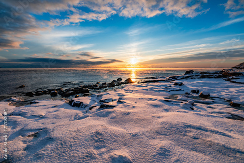 The coast of the Gulf of Finland in winter at sunset photo