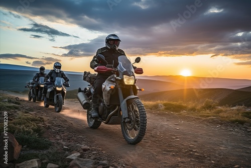 Sunset mountain biking. adventurous cross country riders conquer majestic landscape © sorin