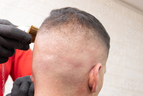 a man having his hair cut in a hair salon
