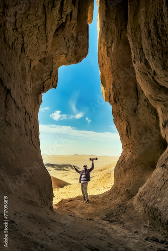 The photographer at desert cave near Riyadh, Saudi Arabia. photo