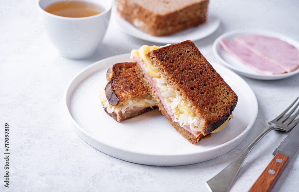 Reuben sandwich with ham, sauerkraut and cheese Reuben sandwich with ham, sauerkraut and cheese