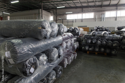 Rolls of black fabric and textiles