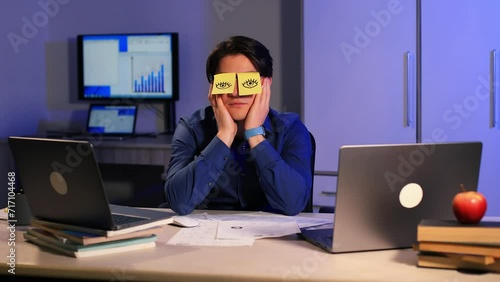 Funny businessman napping at office desk man sleep closed eyes with sticky notes