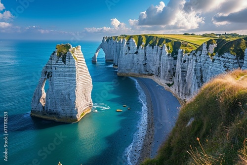 Picturesque panoramic landscape on the cliffs of Etretat. Natural amazing cliffs. Etretat, Normandy, France, La Manche or English Channel. Coast of the Pays de Caux area in sunny summer day. France