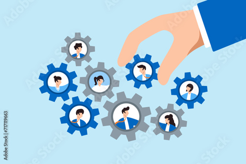 Businessman place new employee to fix cogwheel gears