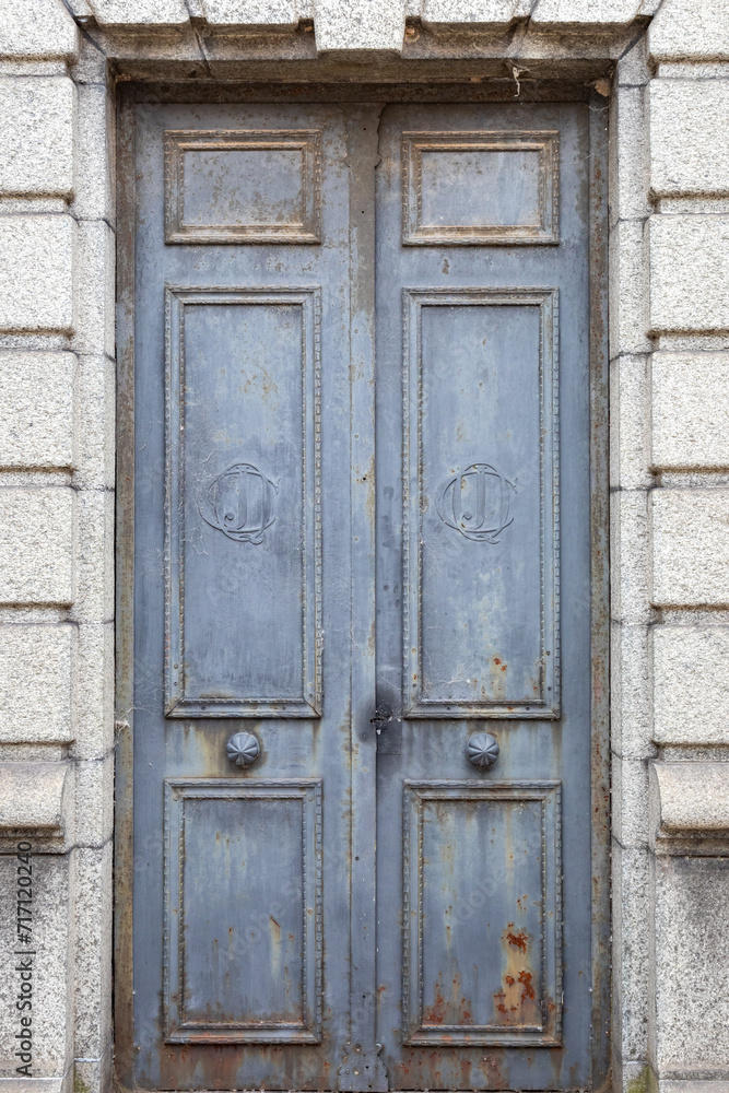 A Weathered Blue Paneled Wooden Door in a Crypt in Recoleta Cemetery, Buenos Aires, Argentina