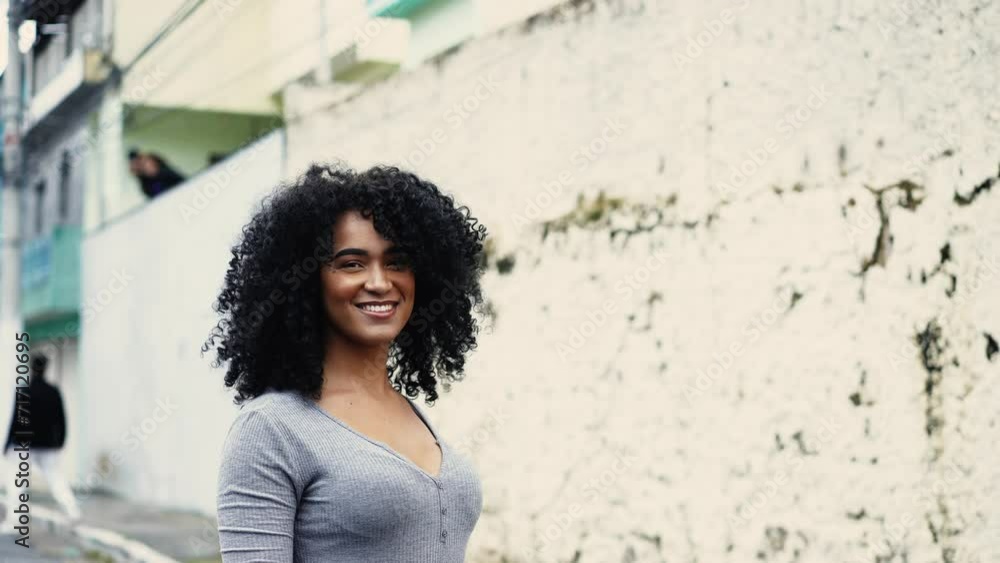 Confident African Descent Woman Walking in Urban South American City, One Curly-Haired Black Female Exuding Joy and Empowerment Confident African Descent Woman Walking in Urban South American City, One Curly-Haired Black Female Exuding Joy and Empowerment