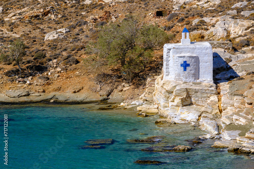 Tiny white church by the sea on Tinos Island, Greece photo