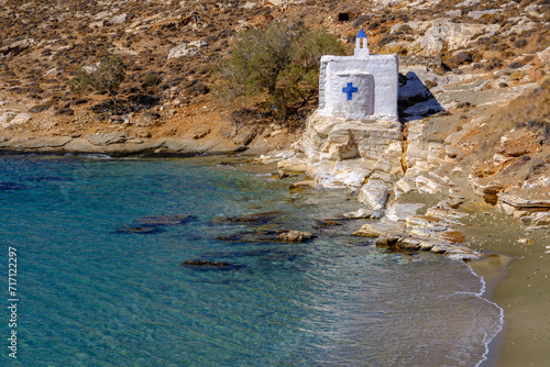 Tiny white church by the sea on Tinos Island, Greece photo