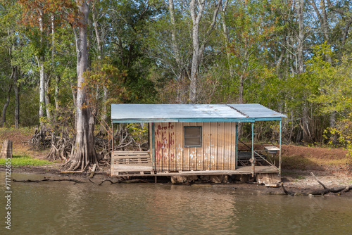 A Small Floating Home Along the Shore in Atchafalaya Swamp, Stranded Above Water Due to Drought, Near Basin Landing, Louisiana 