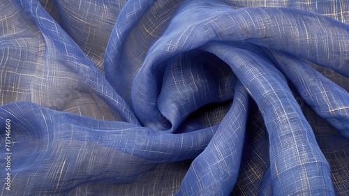 Close-up of blue fabric with golden thread details