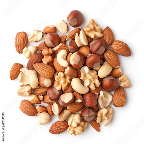 A top view of a variety of mixed nuts including almonds, hazelnuts, and cashews isolated on a white background