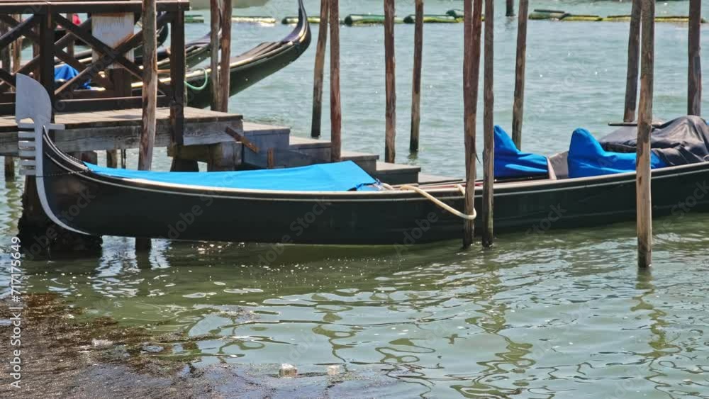Traditional Venice Canal Gondola Boat Moored at Pier Traditional Venice Canal Gondola Boat Moored at Pier