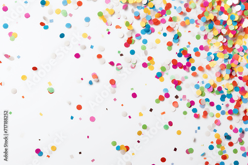 Colorful confetti scattered on a white background