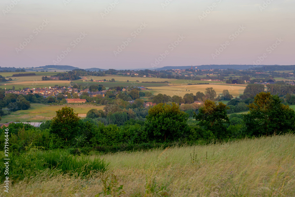 Summer landscape, The terrain hill countryside in Zuid-Limburg, Small houses on hillside in the evening during sunset, Gulpen-Wittem is a villages in Dutch province of Limburg, Gulperberg, Netherlands