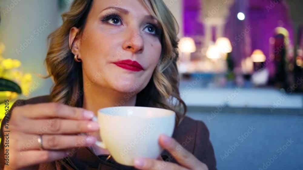 Closeup portrait of woman drinking tea from white cup Closeup portrait of woman drinking tea from white cup