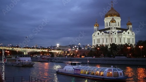 Modern ships sail on river near Christ Saviour Cathedral in Moscow