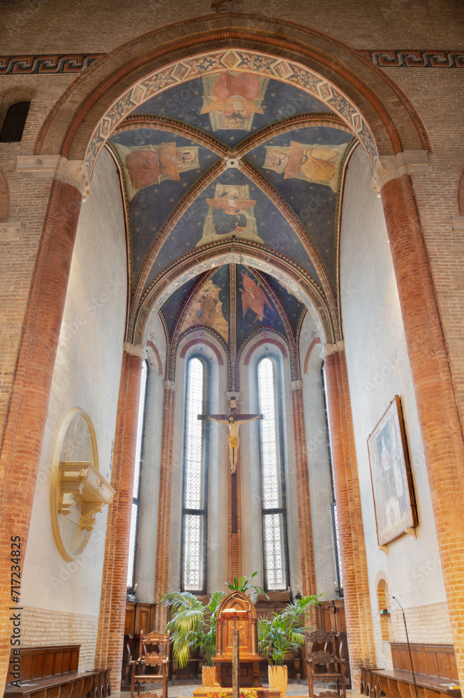 TREVISO, ITALY - NOVEMBER 4, 2023: The presbytery in church Chiesa di San Francesco with the crucifixion and fresco of Four Evangelist on the ceiling of  by disciples of Tomaso da Modena (1326-1379).