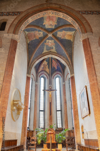 TREVISO, ITALY - NOVEMBER 4, 2023: The presbytery in church Chiesa di San Francesco with the crucifixion and fresco of Four Evangelist on the ceiling of by disciples of Tomaso da Modena (1326-1379).