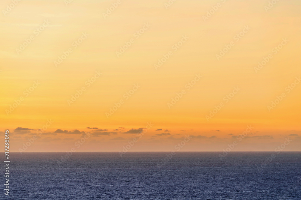 sunset over calm ocean, sunrise, orange sky