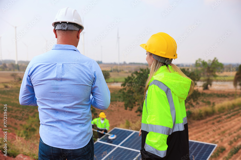 Businessman or owner check job progress of solar panel installation, sustainable and renewable energy, business discussion Businessman or owner check job progress of solar panel installation, sustainable and renewable energy, business discussion