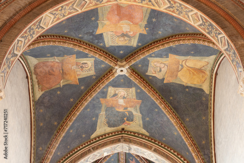 TREVISO, ITALY - NOVEMBER 4, 2023: The fresco of Four Evangelist on the ceiling of presbytery in the church Chiesa di San Francesco by disciples of Tomaso da Modena (1326-1379). photo