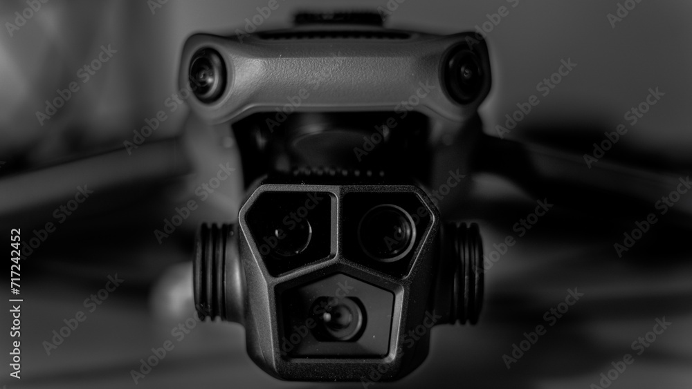 Black and white macro image of a drone with 3 camera gimbal