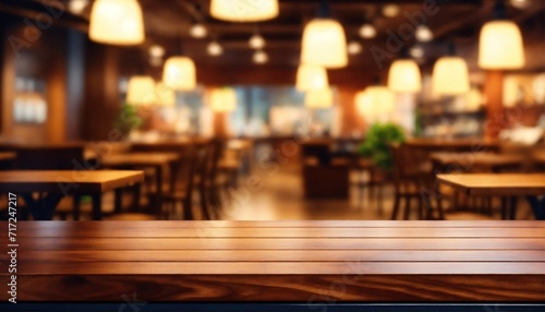 Wooden board empty table in front of blurred background. perspective brown wood over blur in coffee shop - can be used for display or montage your products.mock up for display of product. © Wix