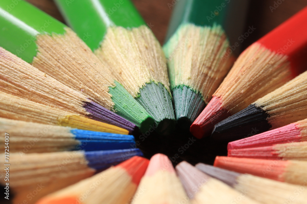 Macro photo of colored pencils together in a circle. Concept of desk tools. Macro photo of colored pencils together in a circle. Concept of desk tools.