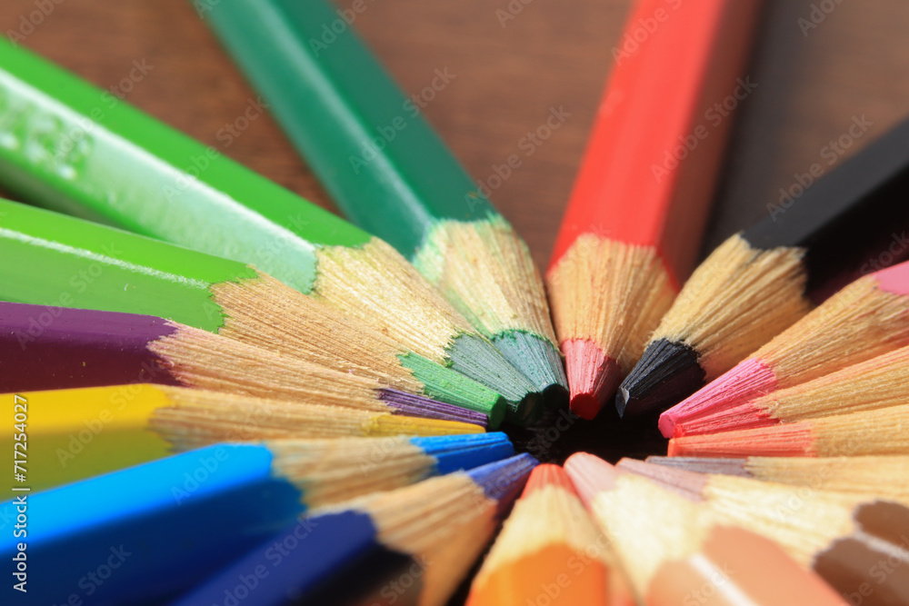 Macro photo of colored pencils together in a circle. Concept of desk tools. Macro photo of colored pencils together in a circle. Concept of desk tools.