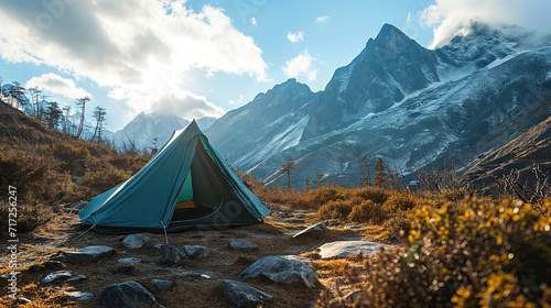 Camping in the mountains on a background of snow-capped peaks