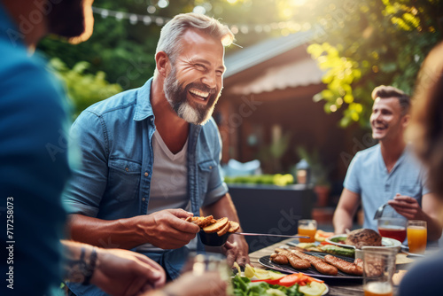 Middle-aged dad with graying temples and a dad bod  laughing heartily while grilling burgers in the backyard during a sunny Sunday afternoon family barbecue