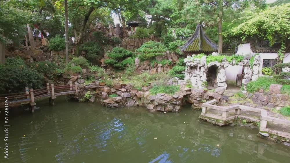 Ancient style buildings near pond in Yuyuan Garden at autumn day Ancient style buildings near pond in Yuyuan Garden at autumn day