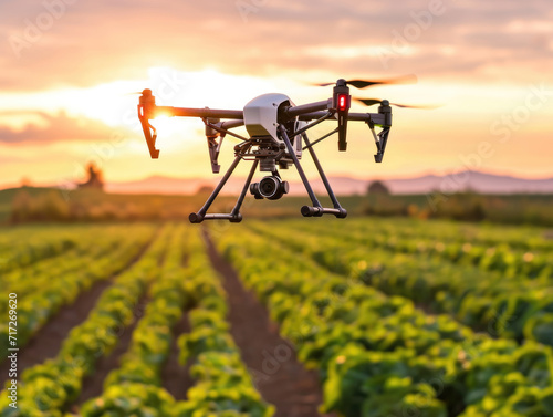 A modern drone flying above an agriculture field