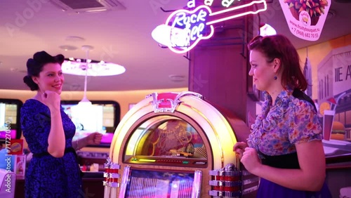 Two women with jukebox in Beverly Hills Diner  photo