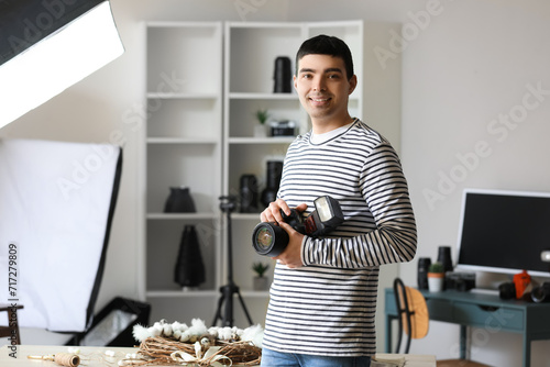 Young male photographer wit...