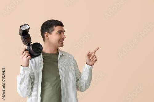Young male photographer wit...