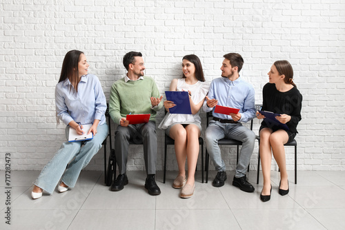 Young people waiting for job interview in room