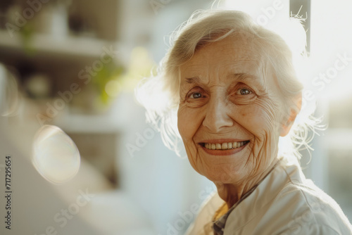 A senior retired old nurse with white hair in a clinic or lab, healthcare setting and smiling at the camera. 