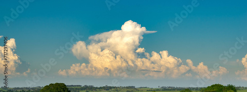 Beautiful white clouds on the horizon, summer Cumulonimbus clouds © asaffsouza