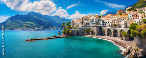 A panoramic view of a picturesque Mediterranean town, with elegant buildings perched along a curving shoreline, overlooking the tranquil turquoise sea