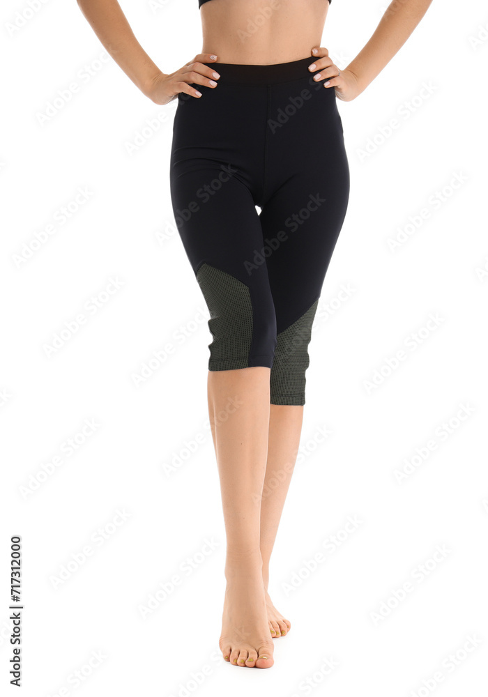 Young woman in black cycling shorts on white background Young woman in black cycling shorts on white background